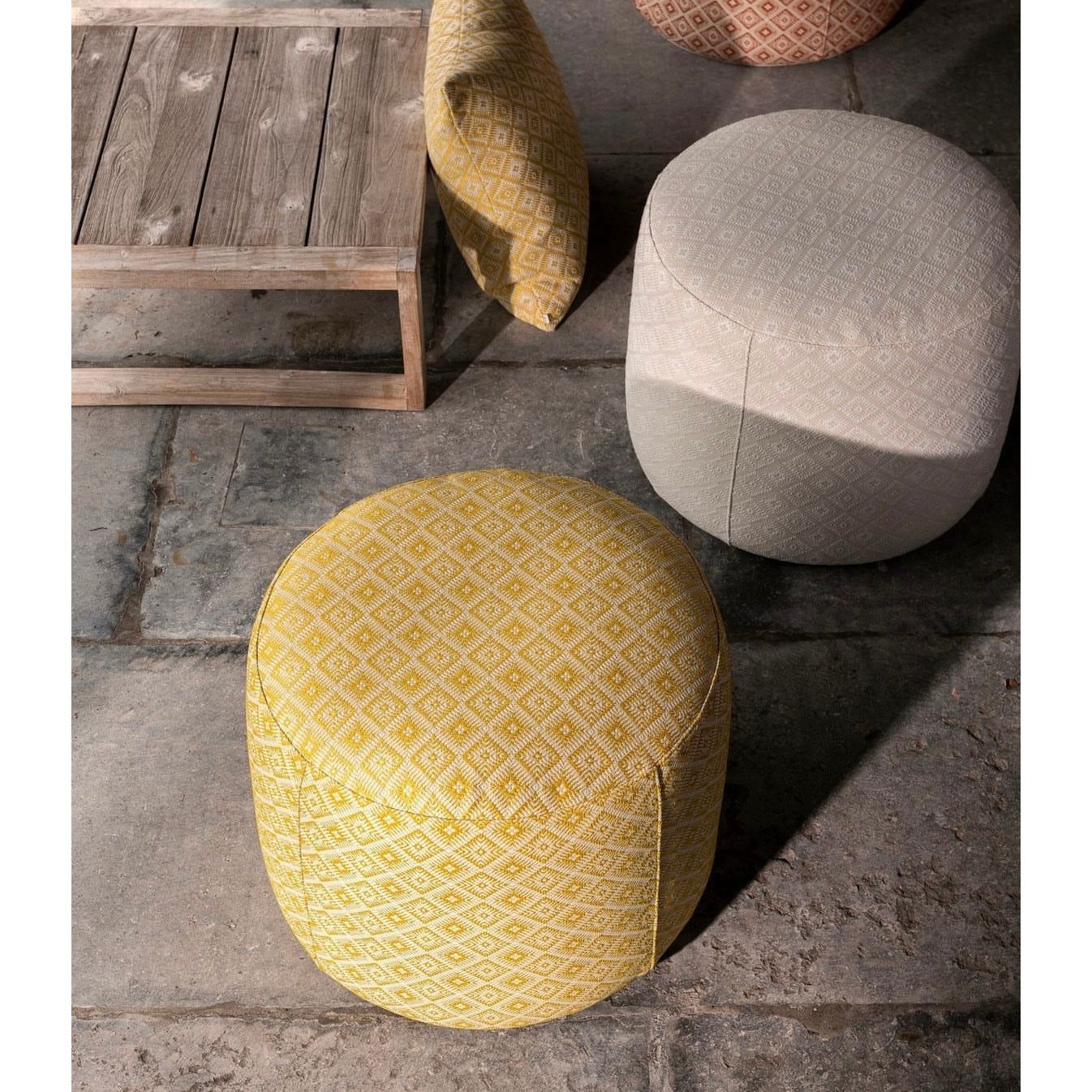 Scapa_Home_poufs_Rossano_terrace_setting ochre amber and off-white