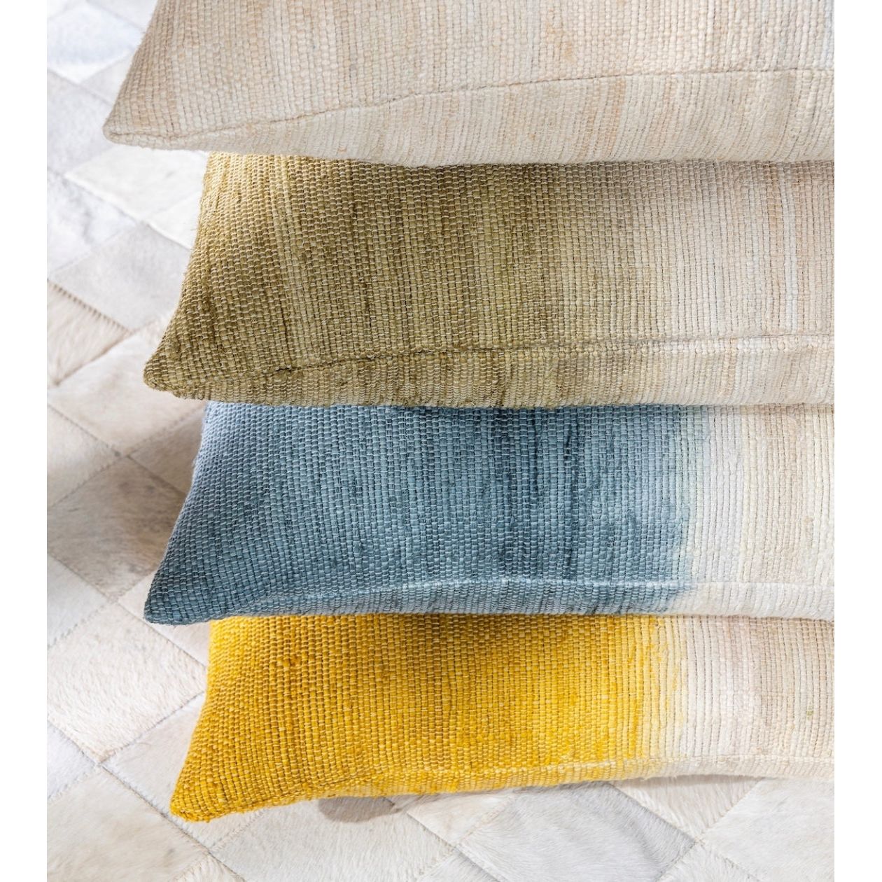 Scapa_Home_cushion_silk dip dyed Usha_blue olive and ochre indoor_setting Scapa_Home_cushion_silk dip dyed Usha_blue olive and ochre indoor_setting