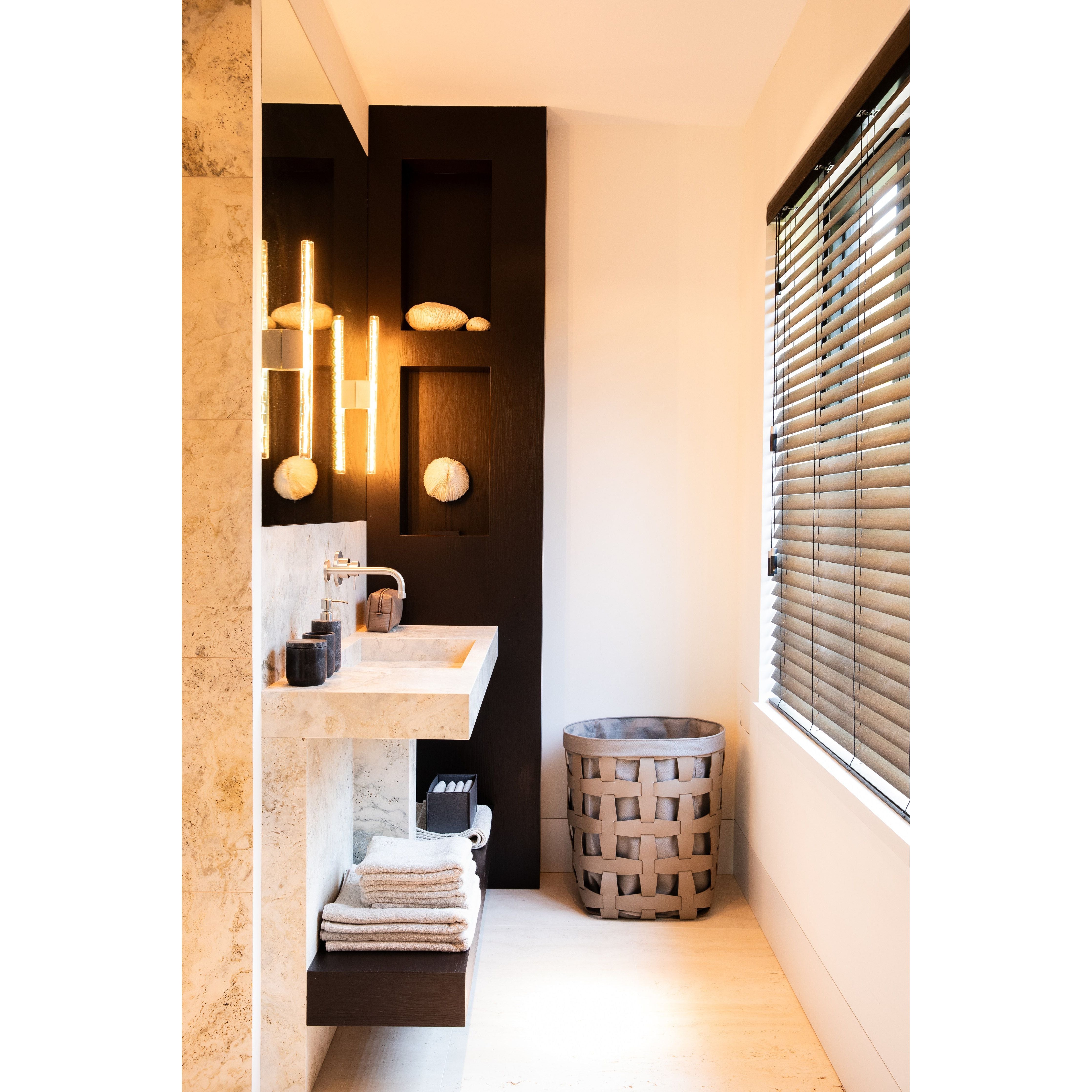 Pinetti_leather laundry basket and toiletry bag with Scapa_home_amenities bathroom_setting Pinetti_leather laundry basket and toiletry bag with Scapa_home_amenities bathroom_setting