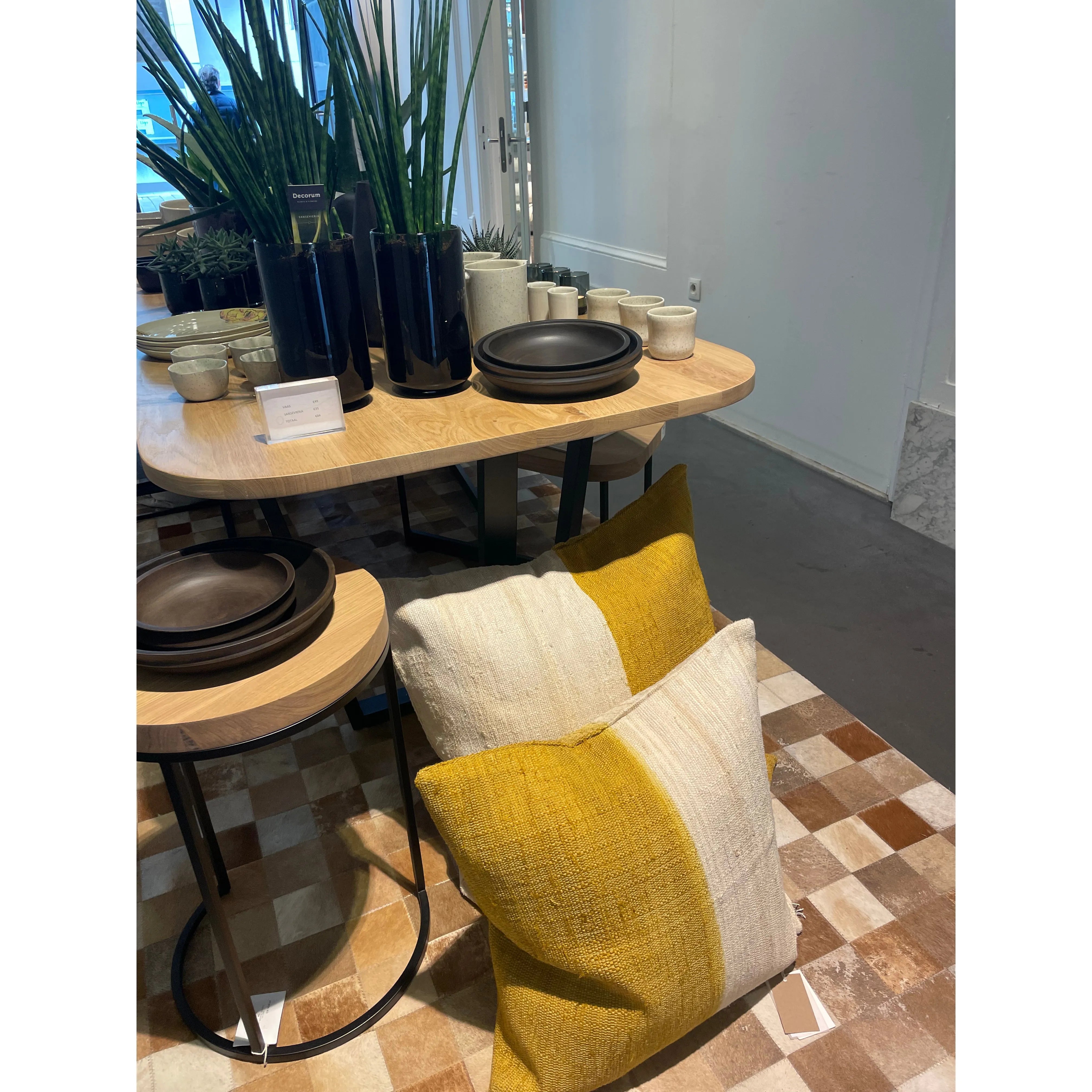 Scapa Home cushion Usha ochre on floor