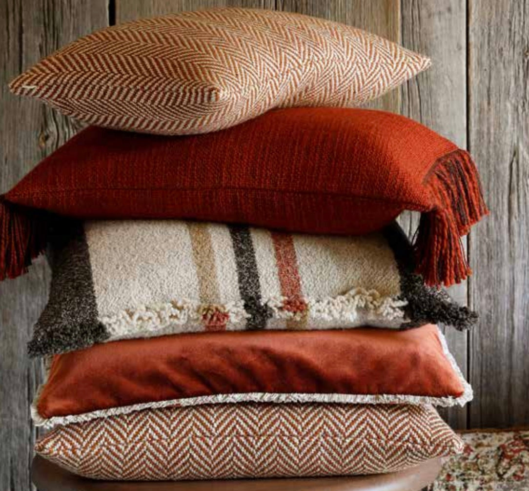 Scapa Home stack of decorative cushions in shades of amber