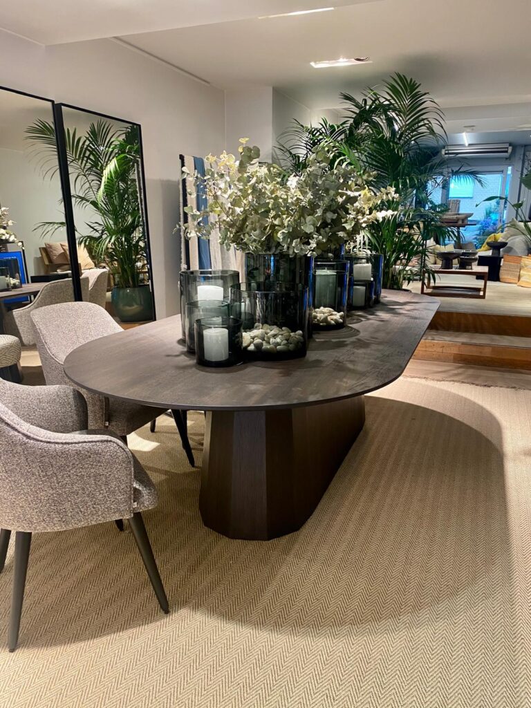 Scapa Home sisal rug 'Saharina' in herringbone vison with oval dining table Colon in brown oak